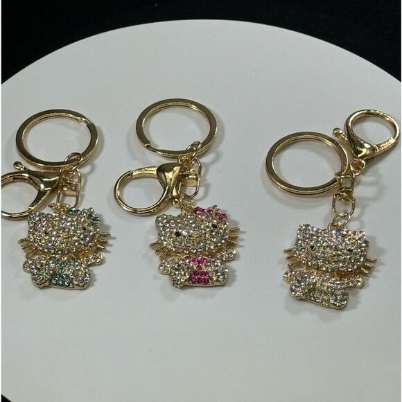 BAG CHARM Hello Kitty Gold Tone Blue Crystal Hair Bow Bag Charm Keychain - Picture 7 of 7